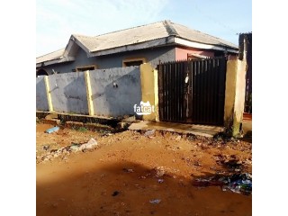 DISTRESS SALE.........2bedroom and a mini flat on almost half plot of land fenced and gated at aboru, ina ipaja,