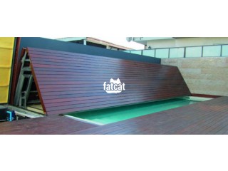 Automatic swimming pool cover